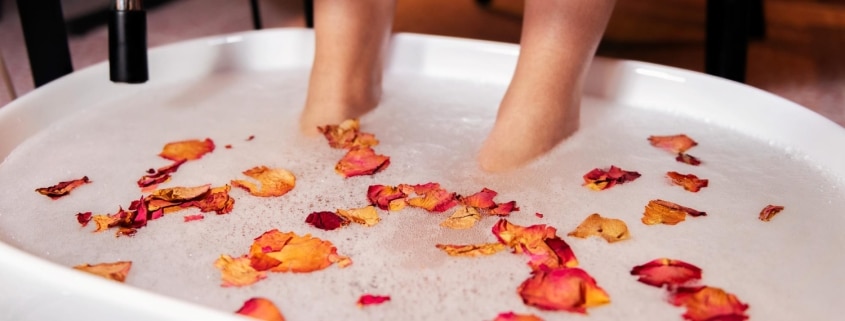female-feet-put-bucket-pedicure